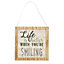 'Life is better when you're smiling' Multicolour Framed plaque (H)19cm x (W)0.9cm
