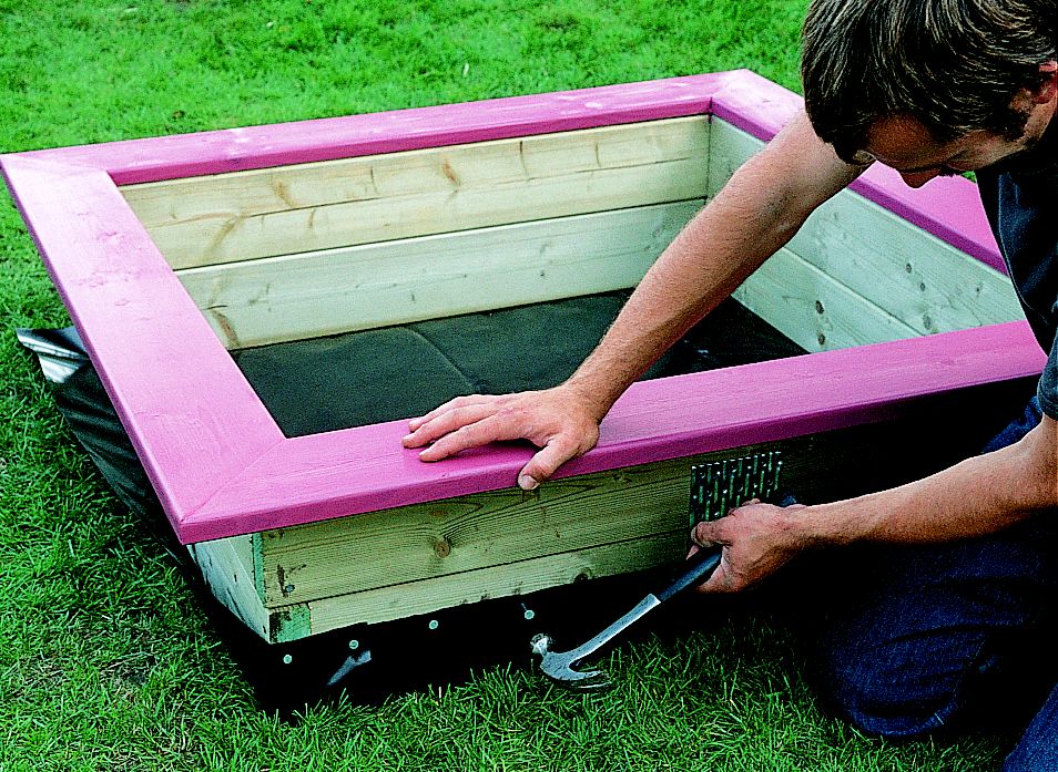 child's sandpit with lid