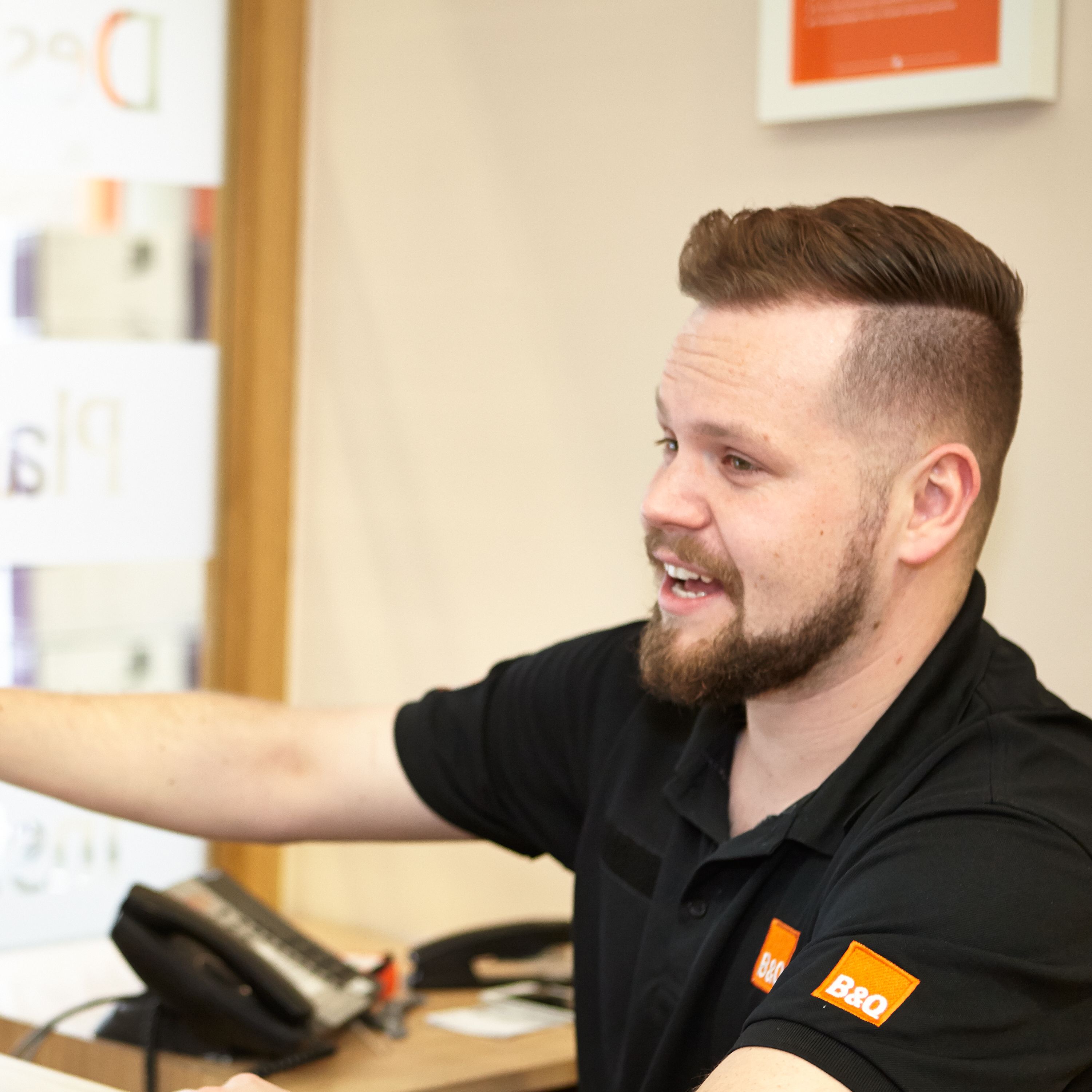 B&Q colleague helping customer