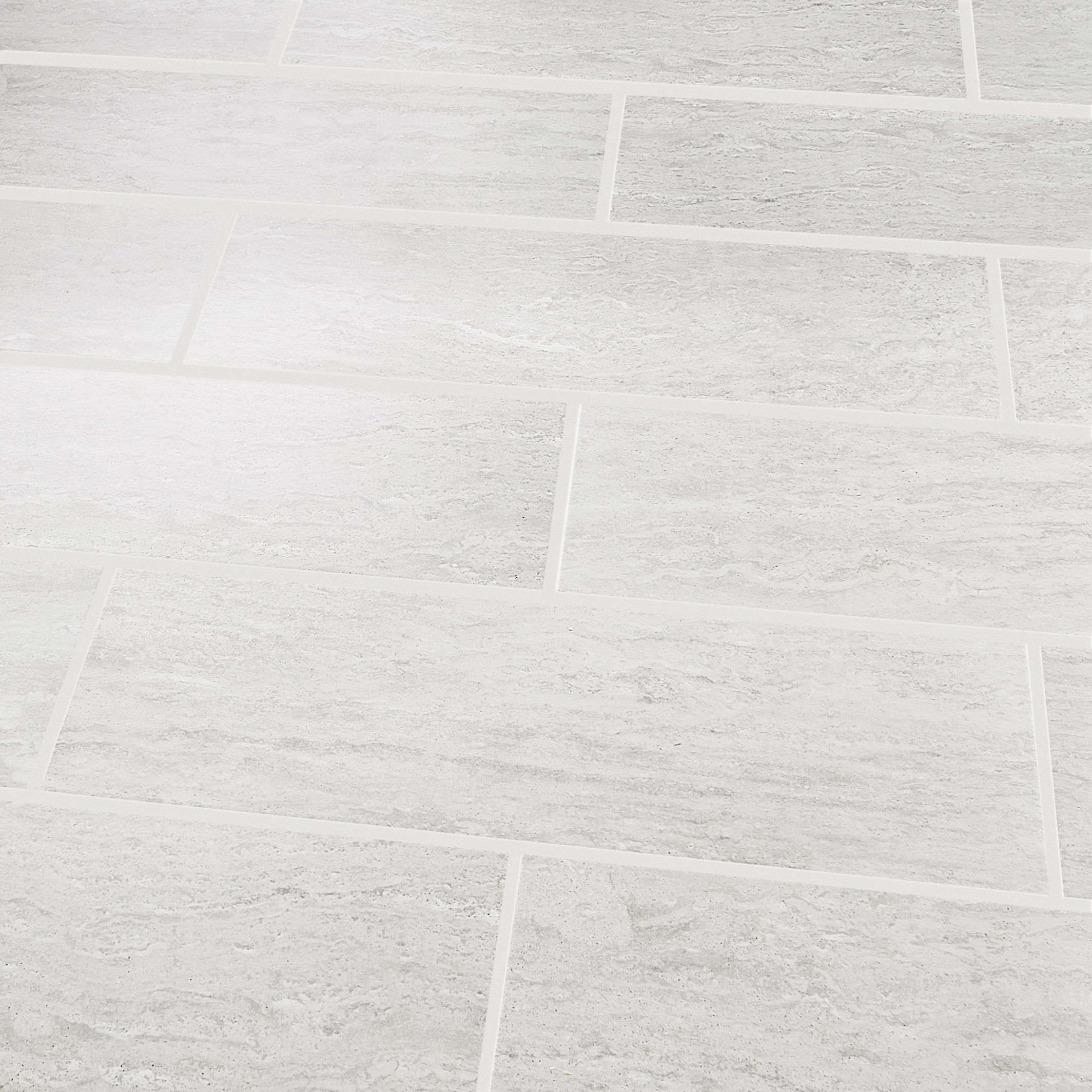 Soft travertin Light grey Matt Stone effect Ceramic Tile, Pack of 9, (L)600mm (W)200mm